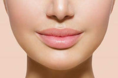 Jolie Vitamin E lip conditioner stick closeup delivers hydration and smoothness.