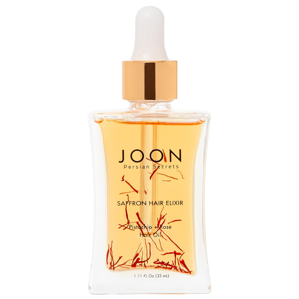 Joon Saffron Hair Elixir bottle pour demonstrates quick absorption for frizz control.