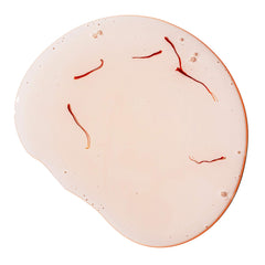 Joon Saffron Hair Elixir heat protection swatch indicates shielding during styling.