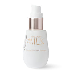 Josie Maran Pure Argan Milk bottle close-up for hydrated, radiant skin.