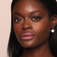 Jouer Demi-Matte Lip Balm includes jojoba oil and shea butter for hydration.