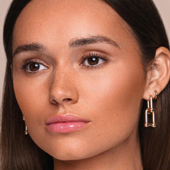 Jouer Sunswept Bronzer Duo on cheeks for seamless blend and warmth.