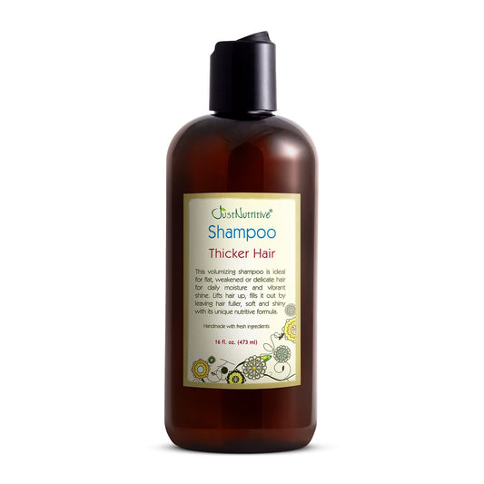 Just Nutritive Thicker Hair Shampoo bottle front view promotes fuller-looking hair