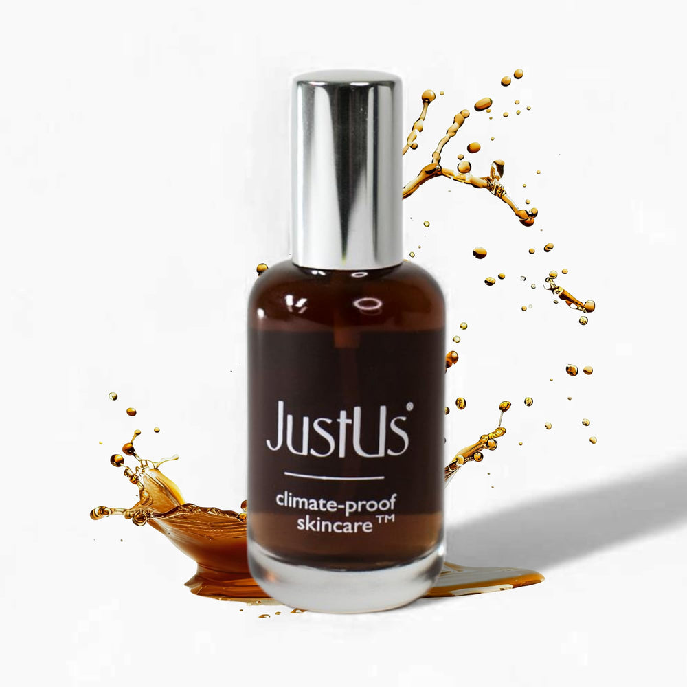 Just Us Tighten + Glow Serum Mist bottle ready for a refreshing hydration boost.