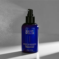 Kacey Welch All In Wonder spray application close-up for effortless detangling.