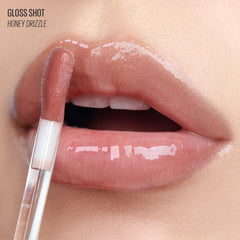 Kaja Gloss Shot Honey Drizzle swatches reveal sheer nude with pearlescent pearls.