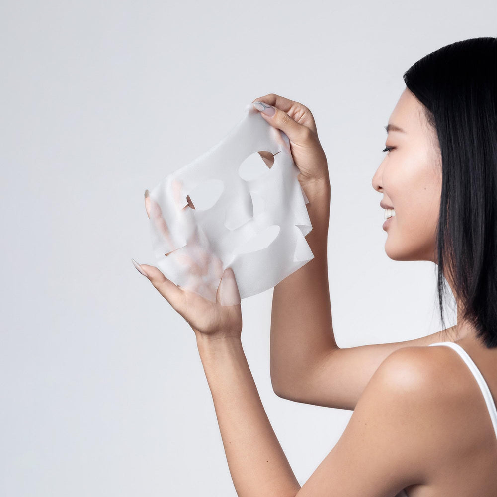 Karuna Clarifying Mask on face demonstrates soothing application for a balanced complexion.