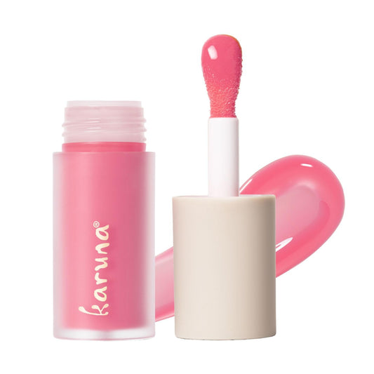 Karuna Float tinted lip oil bottle closeup showing hydrating color