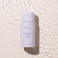 Hands applying Karuna Hydrating Face Toner during routine.