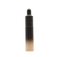 Close-up of Kat Von D Good Apple concealer packaging showing a sleek tube.
