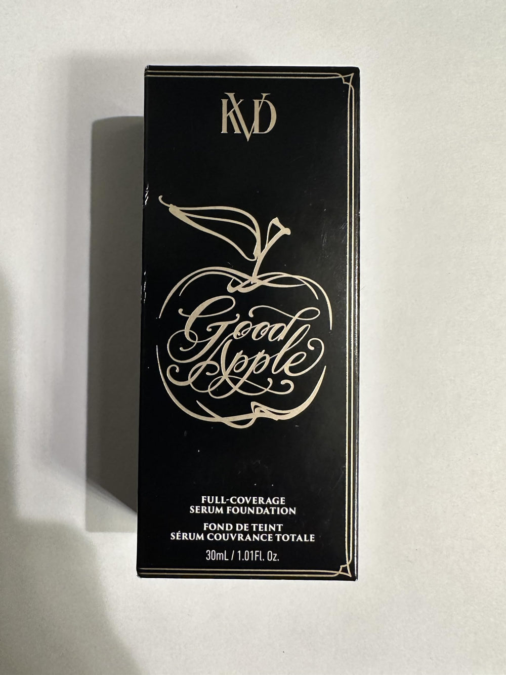 Kat Von D Good Apple swatch on skin demonstrates full-coverage texture.
