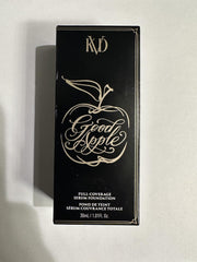Kat Von D Good Apple swatch on skin demonstrates full-coverage texture.