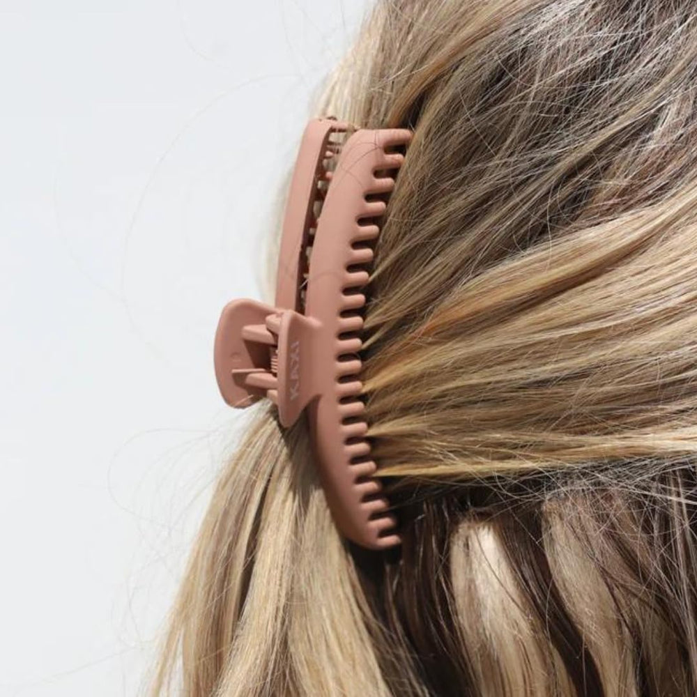 KAXI Hold Everything Midi Claw shown on curly hair for dependable hold.