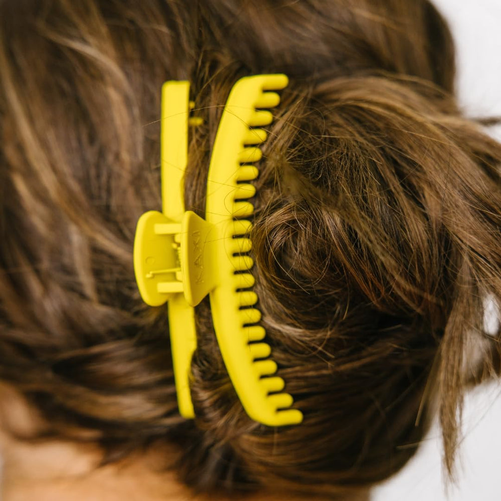 KAXI Hold Everything Midi hair claw neon yellow adds a vivid color pop to any hairstyle