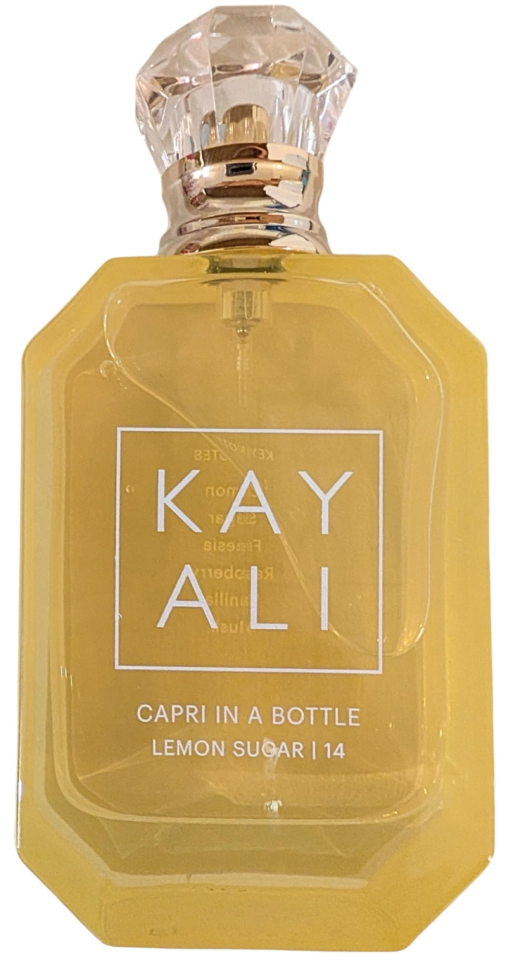 Kayali Capri liquid glow closeup emphasizes creamy vanilla and warm depth.