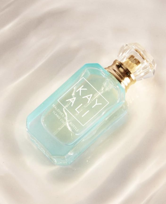 KAYALI Maldives in a Bottle Ylang Coco deluxe mini, perfect for on-the-go fragrance touch-ups.