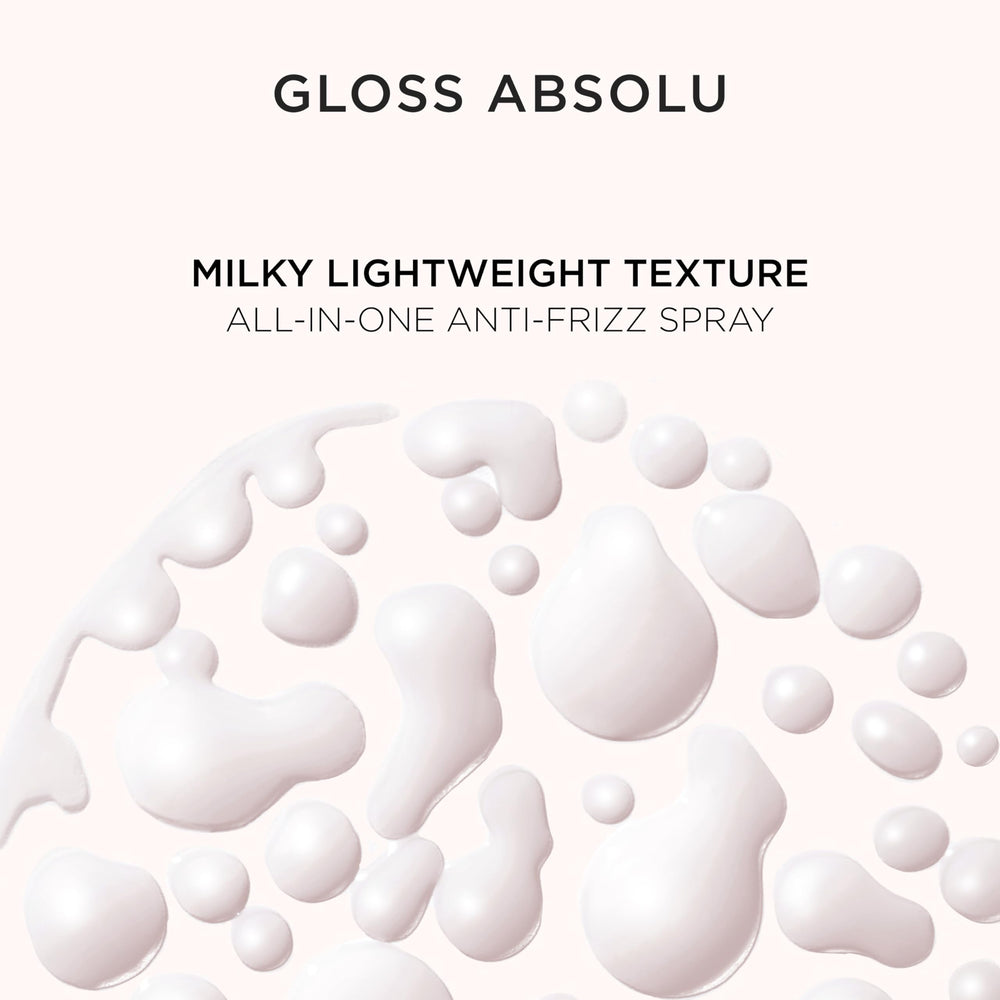 Kerastase Gloss Absolu Glaze Milk travel-friendly bottle sits on vanity.