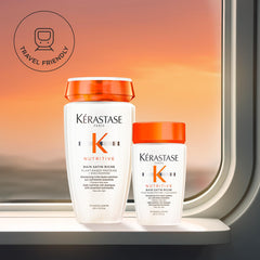 KÉRASTASE Nutritive Bain Satin Riche bottle pours creamy shampoo for cleansing.