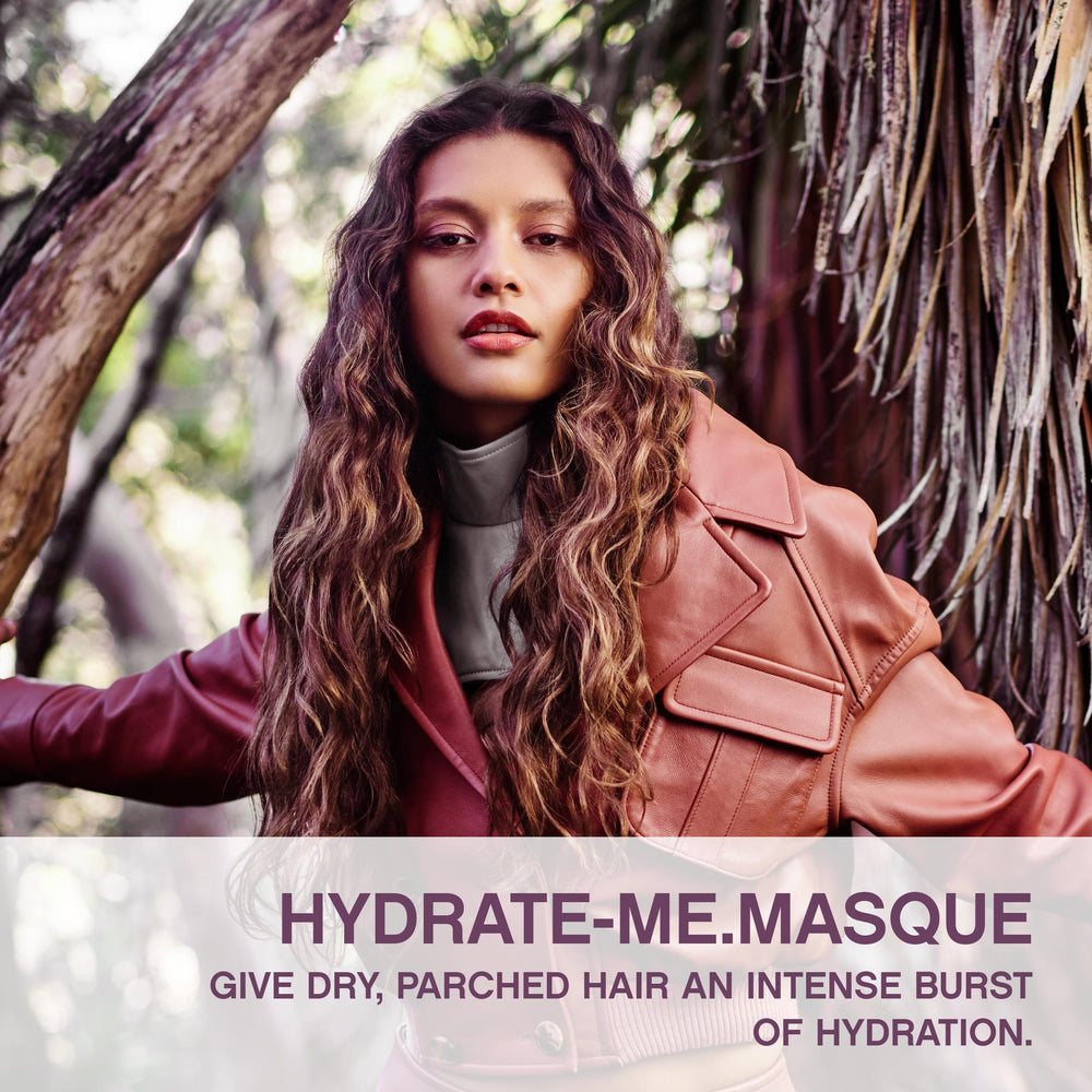 Hands applying KEVIN.MURPHY Hydrate-Me.Masque for smooth, frizz-controlled styling