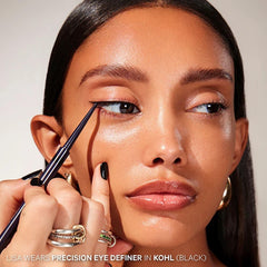 Applying Kevyn Aucoin Precision Eye Definer along the waterline for long-wear definition.