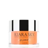 Kiara Sky Glow Collection dip powder bottle applying with smooth brush strokes.