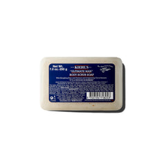 Kiehl's Ultimate Man Body Scrub close-up shows exfoliating texture with oat bran for smooth skin.
