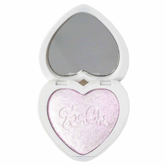 KimChiChic Pearl Gone Wild highlighter on the face for a pearlescent glow.