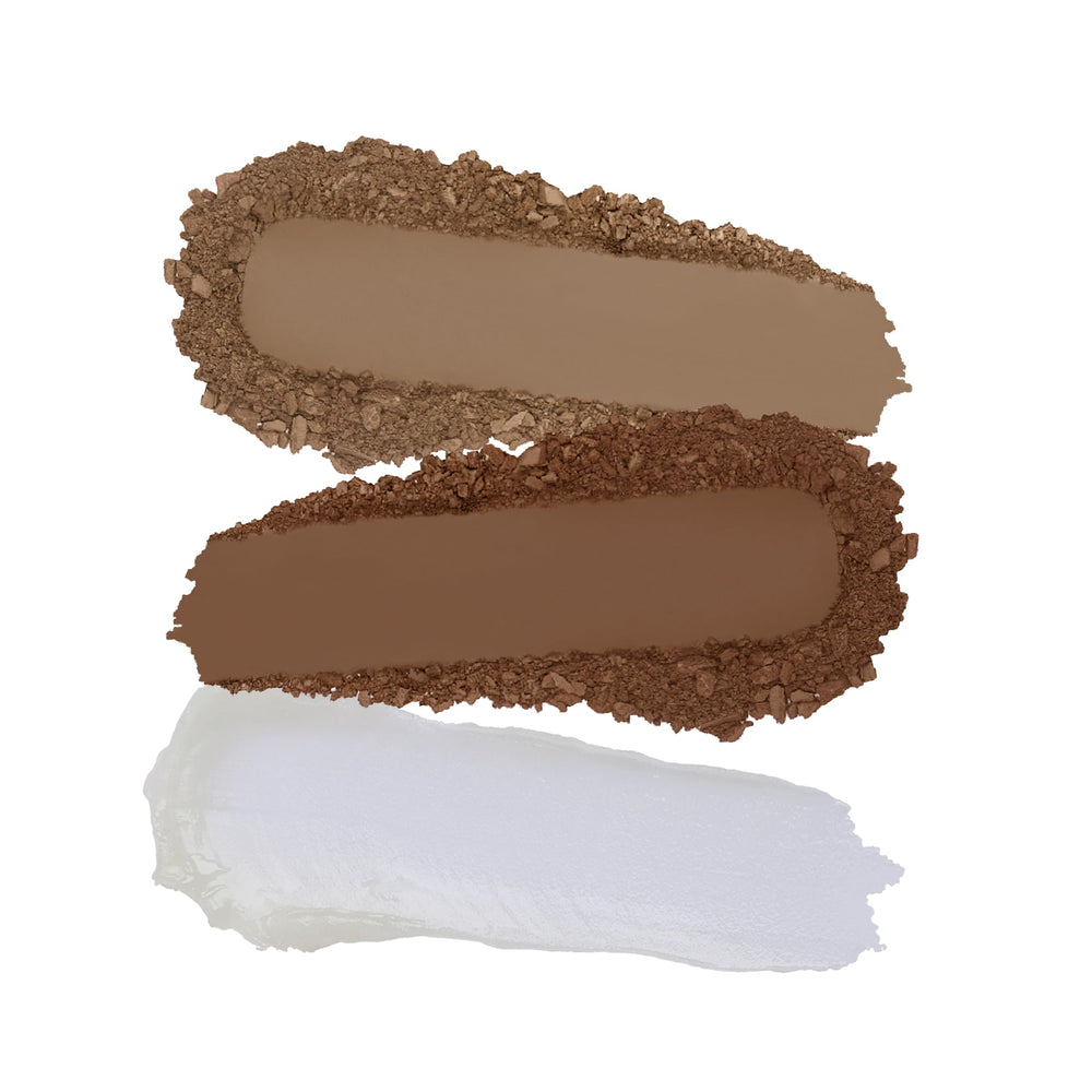 Kimchi Chic Kimbrowly angled brush filling sparse brows with darker shade.