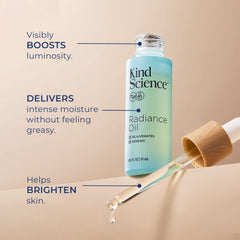 Kind Science Radiance Oil drop on skin shows dewy finish