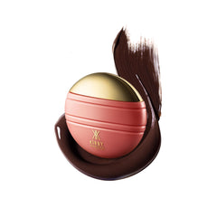 Kirby Kosmetics Konfident Glow bottle closeup shows oil-free, hydrating formula for glass-skin finish.