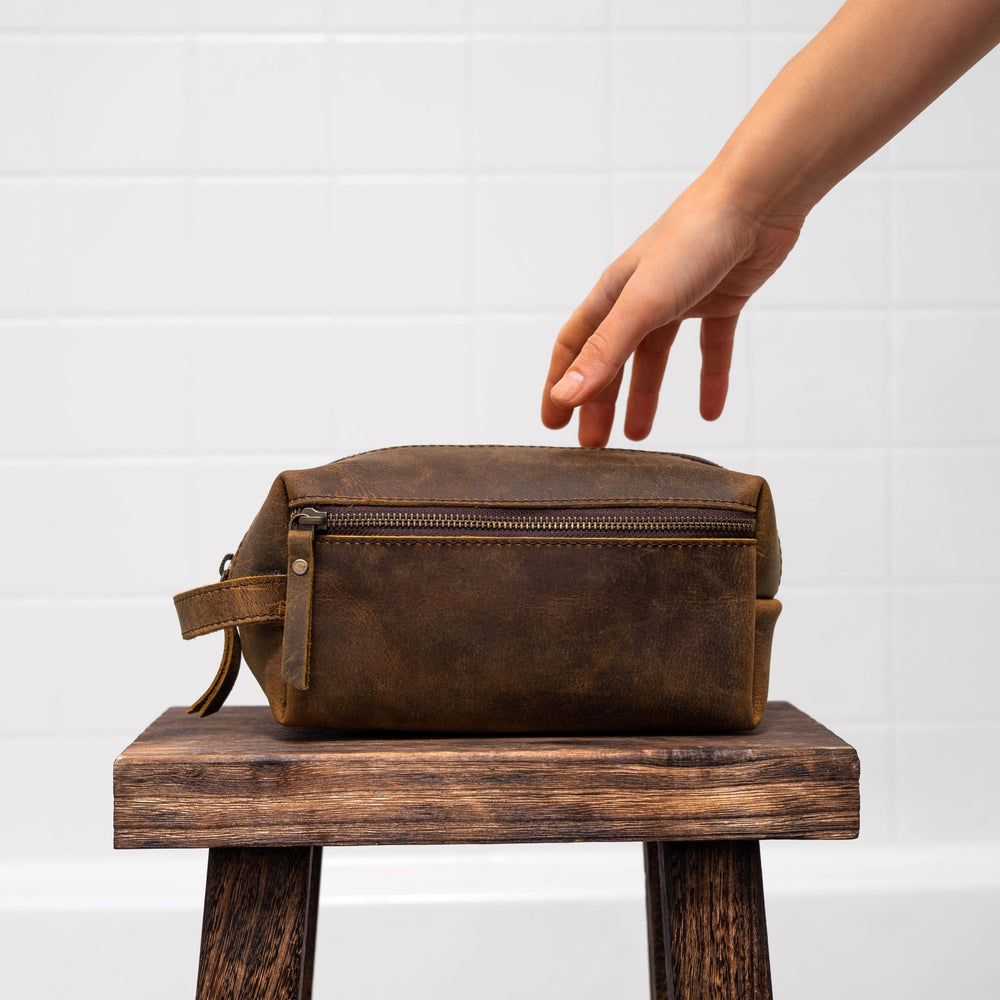 KomalC travel toiletry bag with water-resistant lining protecting contents on the go.