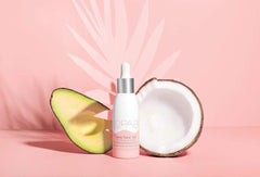 Kopari Save Face Oil packaging swatch on skin with dewy finish