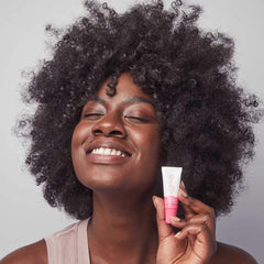 Kopari Lip Glossy vitamin-rich formula nourishes lips.