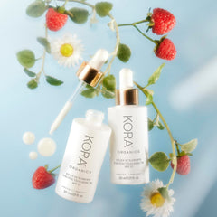 KORA Organics Silky Sun Drops packaging notes blue light protection benefits.