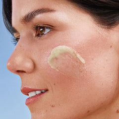 KORA Organics Cleansing Balm travel-size tube supports on-the-go skincare routines.