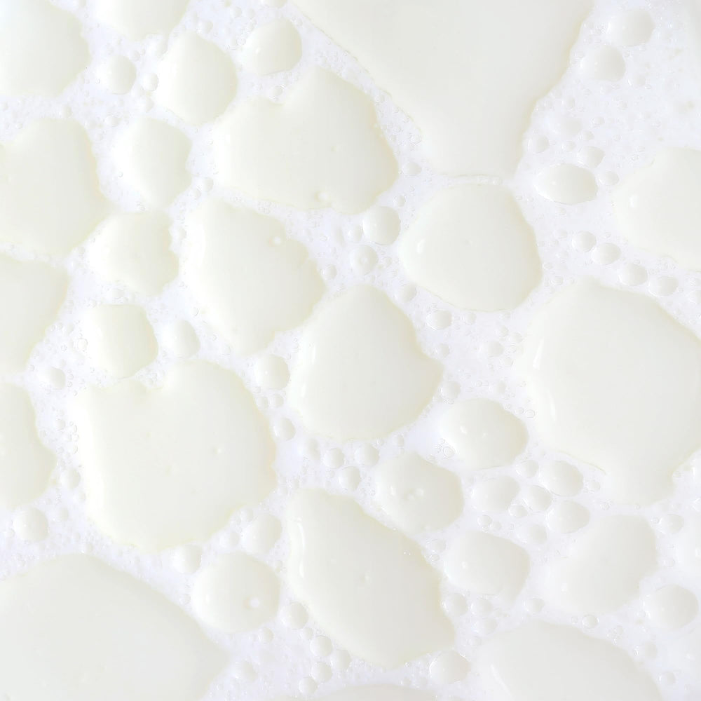KORA Organics Milky Mushroom Oil Cleanser shake-to-milk action activates cleansing