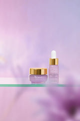 KORA Organics serum texture close-up shows milky finish and smooth feel.