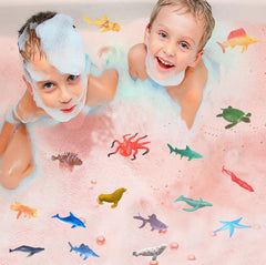 Kottke shark bath bomb red water reveal with playful scene for children.
