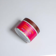 Kreyol Essence ingredients close-up featuring moringa, quinoa, and argan oil for moisture.
