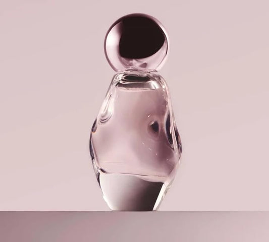 Kylie Cosmic EDP bottle highlights ambery floral notes for versatile wear.