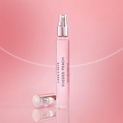Lake & Skye Sueded Peach purse spray cap close-up, showcasing sleek, compact design