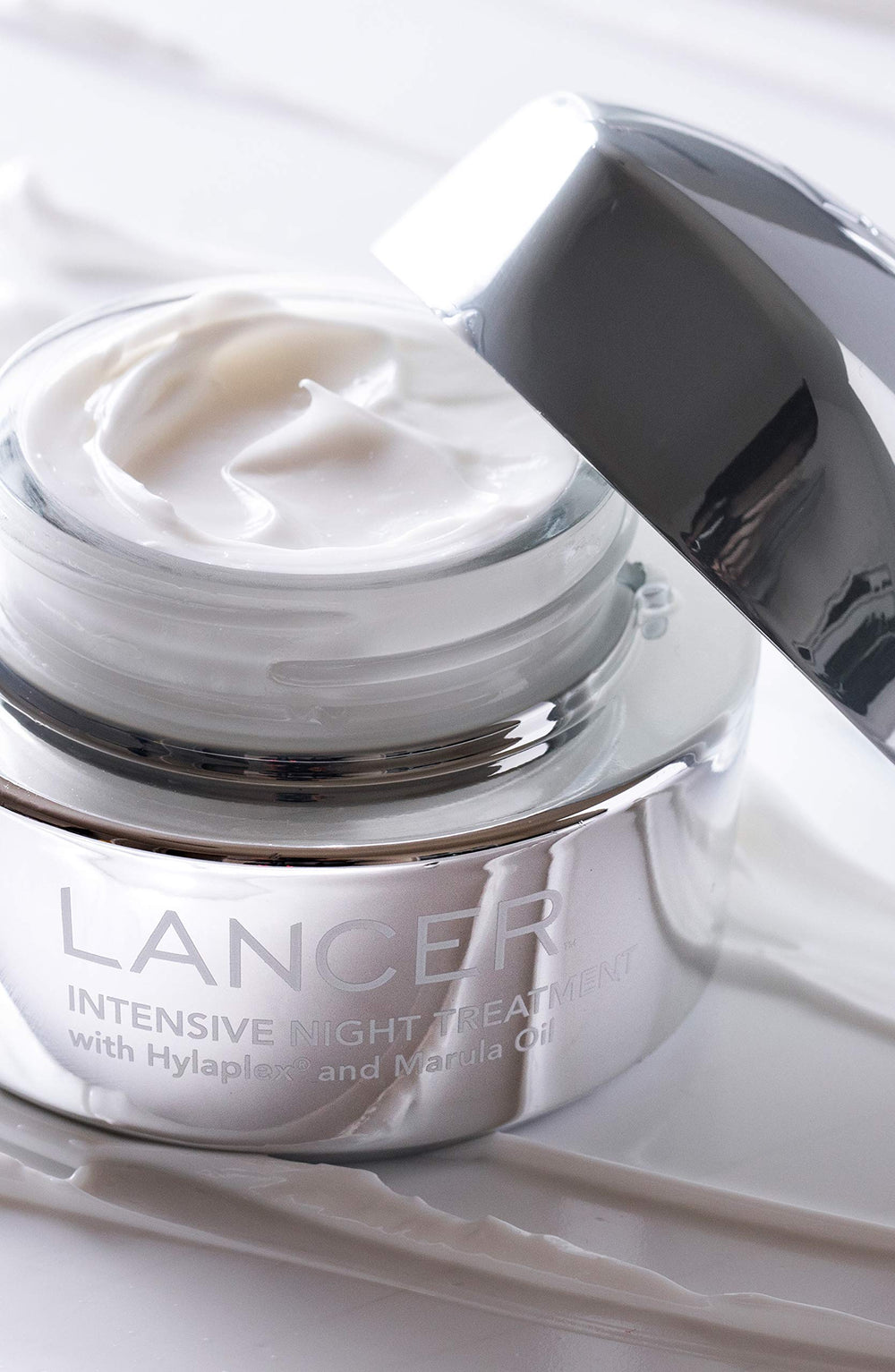 Texture of Lancer Skincare night cream ready for application.