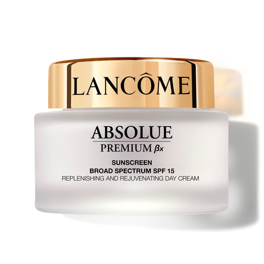 Lancôme Absolue Premium BX Day Cream bottle on vanity for daily hydration.