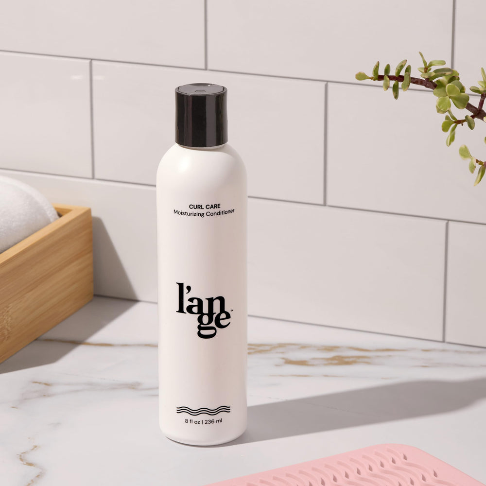 L'ANGE HAIR Curl Care Conditioner on hair showing frizz control and shine.
