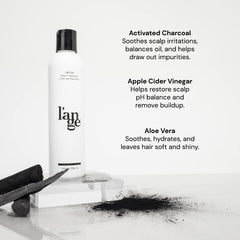 L'ANGE HAIR Detox charcoal shampoo being poured for cleansing.