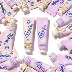 Lanolips 101 Ointment tube shown being warmed for hydration.