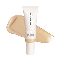 Laura Mercier Tinted Moisturizer bottle with pump delivers dewy hydration for daily wear.