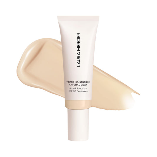 Laura Mercier tinted moisturizer bottle close-up shows dewy glow and SPF 30 protection.
