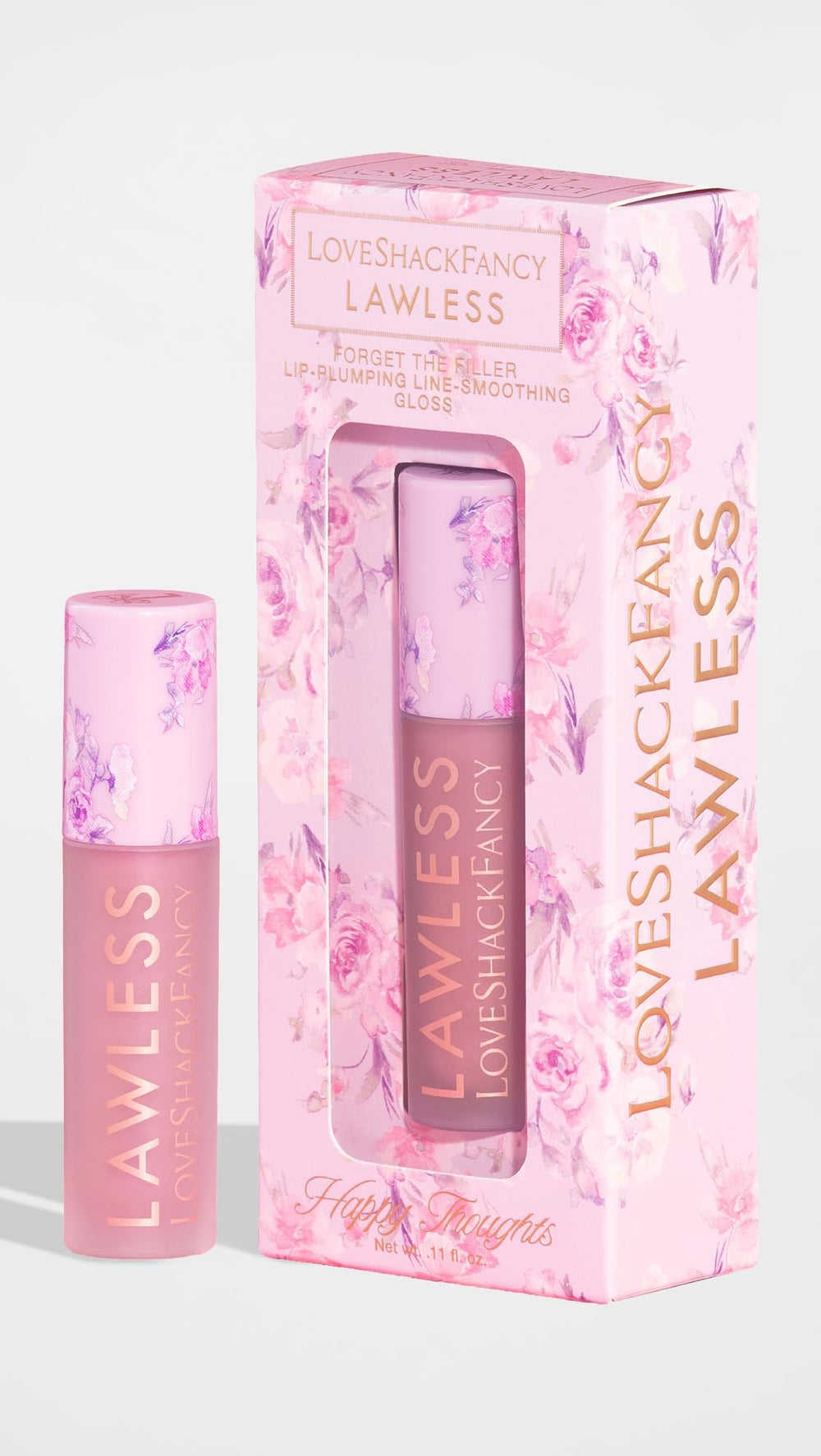 Close-up swatch of Lawless gloss in Happy Thoughts pink for day-to-night wear.