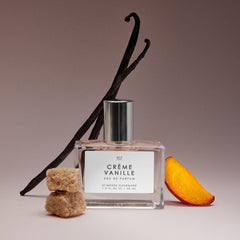Amber-brown sugar notes visible in bottle imagery suggesting rich scent profile.